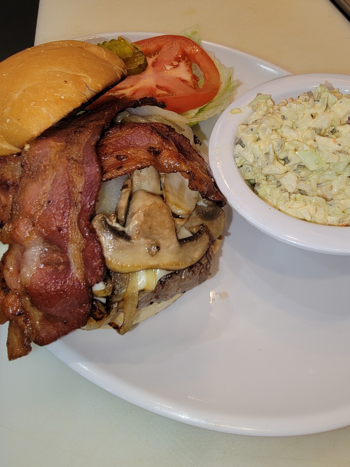 Bacon cheeseburger with mushrooms at The 80's Cafe